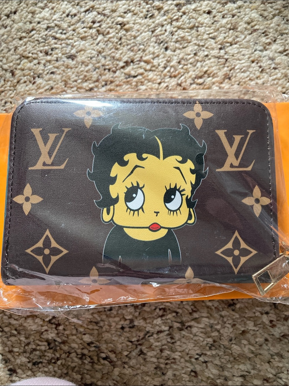 Fashion Monogram Zip Wallet with Betty Boop Graphic in brown .